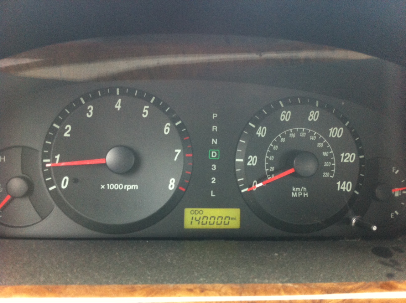 Vehicle instrument cluster showing an odometer reading of 140,000 miles